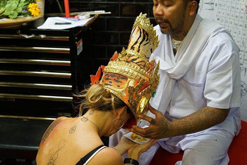 Accepting the Sak Yant Sacred Thai Tattoo from Ajarn Ohr
